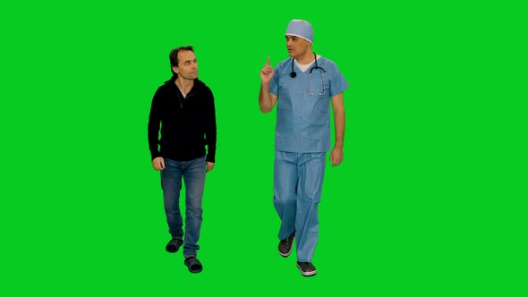 Surgeon Doctor Talking to Patient while Walking on Green Screen