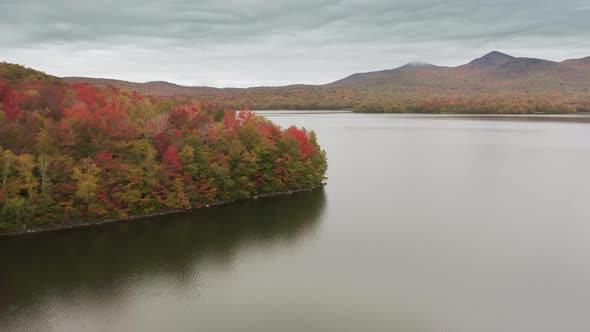 Tranquil Seasonal Landscape with the Mountain in the Clouds in the Background alt