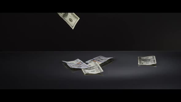 American $100 Bills Falling onto a Reflective Surface - MONEY 0044 alt