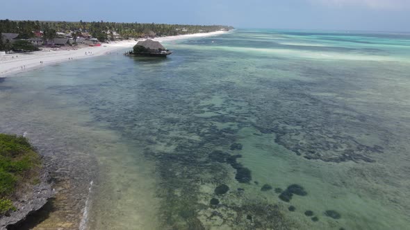 House on Stilts in the Ocean on the Coast of Zanzibar Tanzania alt