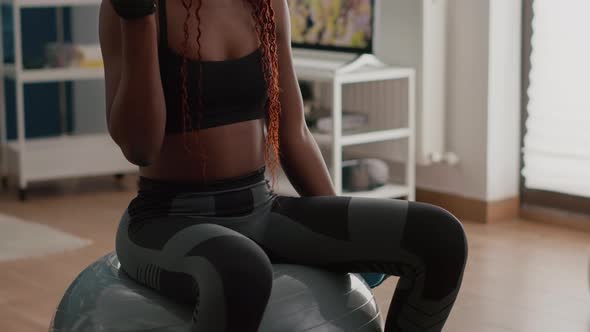 Slim Woman with Black Skin Doing Exercises with Fitness Dumbbells alt