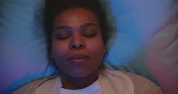 Paramedic in Latex Gloves Putting Oxygen Mask on Patient in Ambulance Auto alt