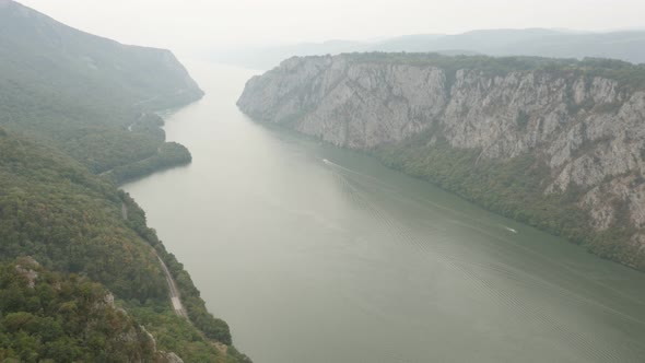 Water transport through Danube river gorge 4K 2160p 30fps UltraHD footage - Boats passing through Ma