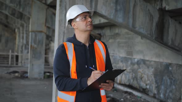 An Engineering Inspector Inspects a Building in a Critical State of Disrepair and Records Problems