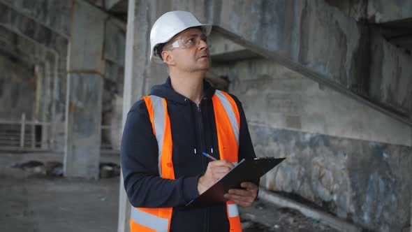 An Engineering Inspector Inspects a Building in a Critical State of ...