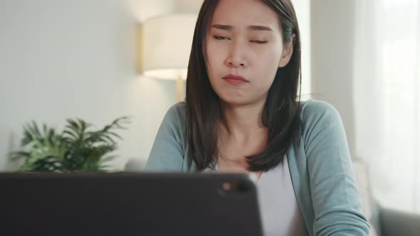 Unhappy Beautiful Asian Woman Showing Thumb Down Sign