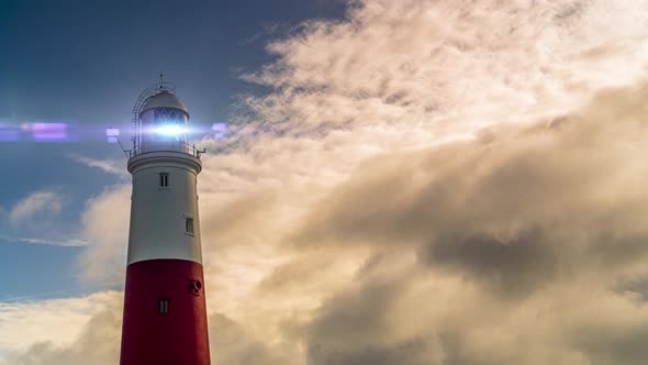 Large lighthouse at sunset time lapse