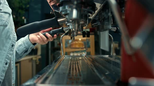 Making a cup of strong coffee in a coffee machine, the back light illuminates the steam and the cup. alt