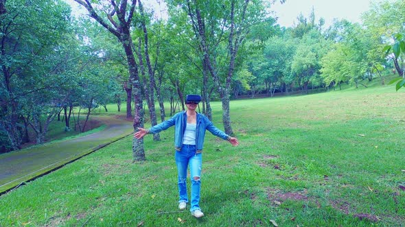 Happy woman wearing VR-headset glasses of virtual reality. alt