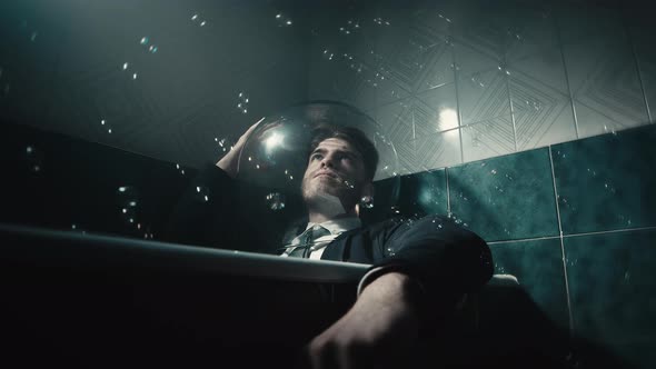 Man with Tie in the Bathtub and Soap Bubbles alt