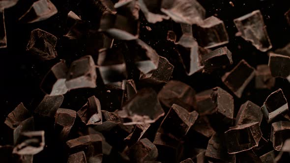 Super Slow Motion Shot of Raw Chocolate Chunks After Being Exploded Towards The Camera at 1000Fps alt