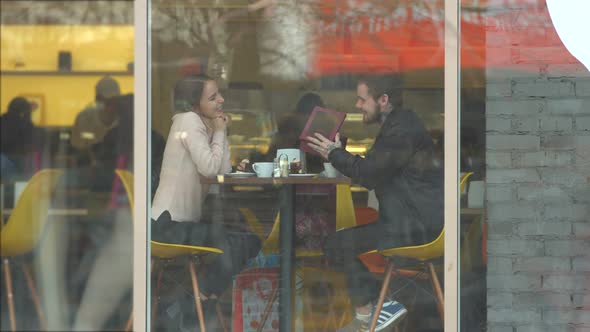Young Couple in Cafe