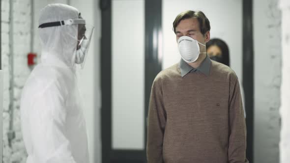 Checking and Screening Office Workers for Chinese Coronavirus Symptoms, Covid-19, Temperature alt