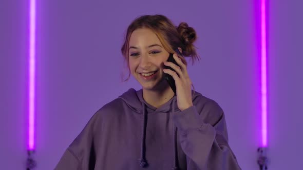 Portrait of Young Attractive Woman Talking for Mobile Phone and Rejoice alt