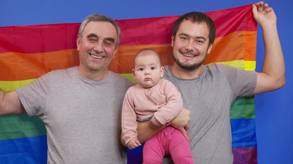 Authentic Shot of Happy Homosexual Male Gay Family with Adopted Toddler Baby Girl Is Smiling in alt
