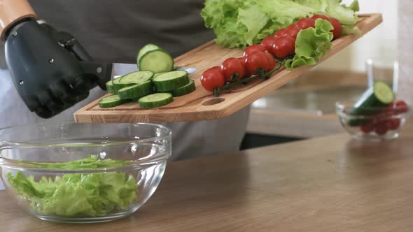 Self-Sufficient Male Amputee with Bionic Limb Making Salad at Home alt