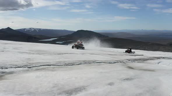 Extreme Buggy Car Drive And Snowmobiling In The Majestic Langjokull Glaciers, Iceland. Aerial Tracki alt