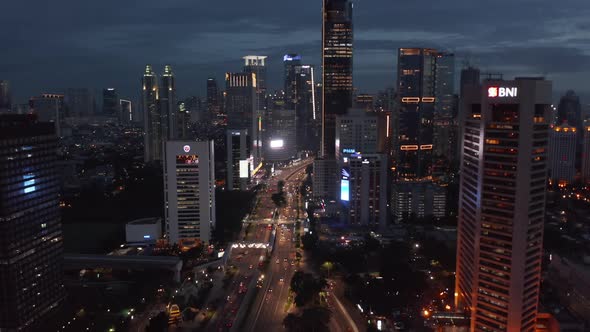 Aerial Tilting Dolly Shot of Night Time Traffic on a Busy Motorway in Jakarta Indonesia alt