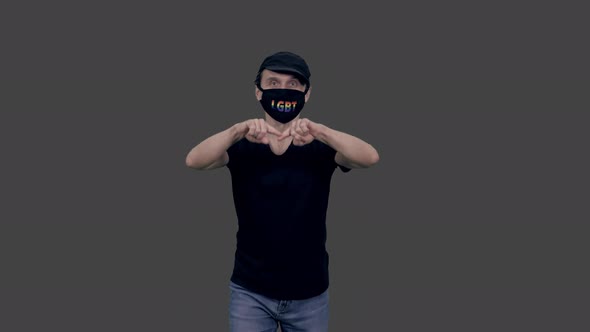 Gay Man in Anti Covid Lgbt Mask Walking and Making Heart by Hands, Alpha in