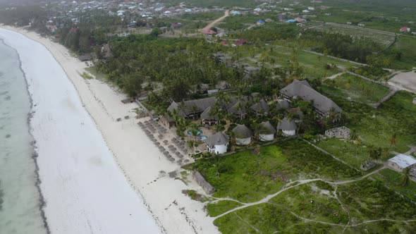 Touristic bungalow resort on white sand beach on Zanzibar coast. alt