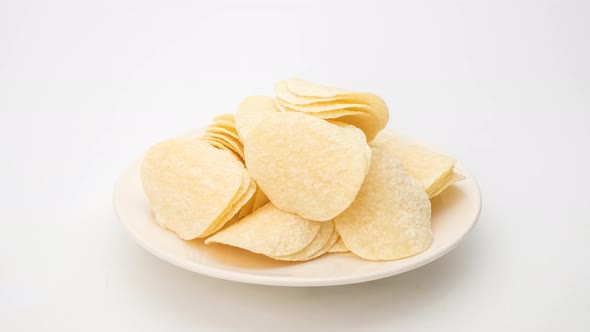 Stop motion animation eat potato chips on white background, Close up.
