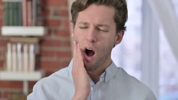 Portrait of Young Man Having Toothache alt
