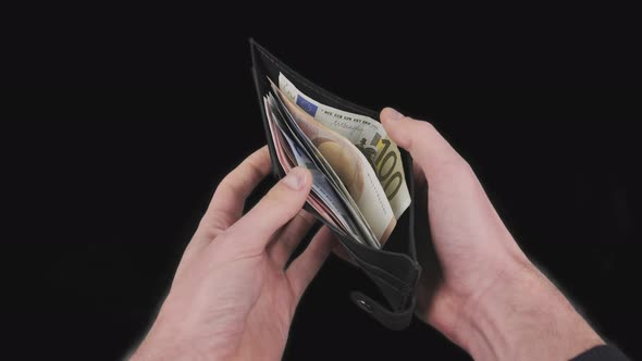 Male Hands Show Black Wallet with Some Various Euro Banknotes with Alpha Channel alt
