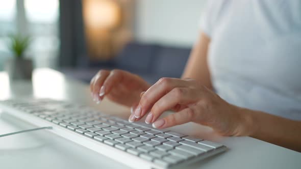Female Hands Typing on a Computer Keyboard alt