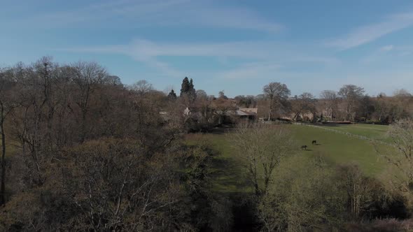 Coteswold Village And Countryside Aerial Slow Rise 4K