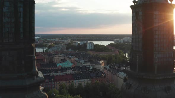 Flying through church towers in Södermalm, Stockholm, Sweden alt