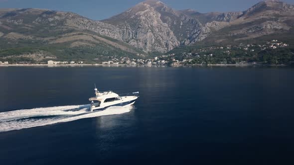 Aerial view of Motor boat on the azure sea of Montenegro alt