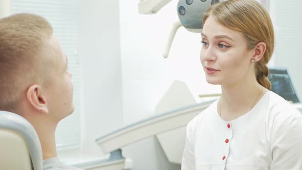European Female Dentist Doctor Treats Patient Portrait
