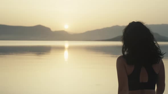 The Girl Exhales After a Morning Jog By the Sea alt