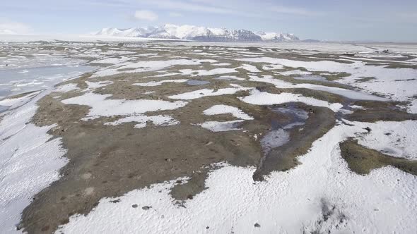 Winter landscape in Iceland, frozen lake and mountains alt
