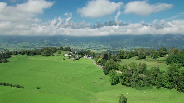 Aerial View of Liechtenstein with Houses on Green Fields in Alps Mountain Valley alt