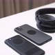 close up video of two dark smartphone and headphones on a white table - VideoHive Item for Sale