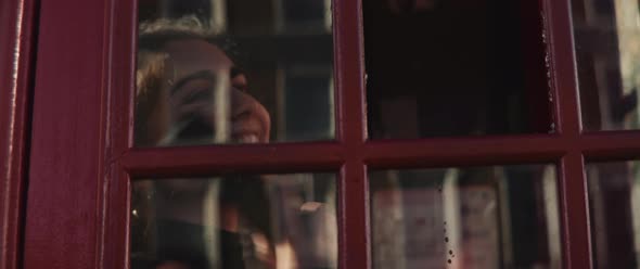 Friends running into each other in a phone booth alt