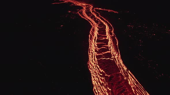 Drone Over Flowing River Of Molten Lava From Erupting Volcano alt