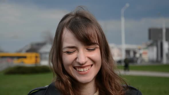 Portrait of Caucasian Beautiful Young Woman Looking at Camera and Smiling Cheerfully alt