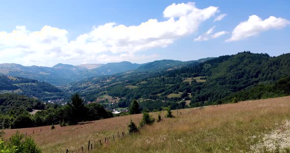 Revealing Shot Of Tranquil Village From Apuseni Mountains In Romania alt