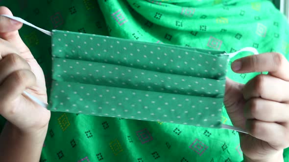 Hand Holding Homemade Protective Face Mask Close Up