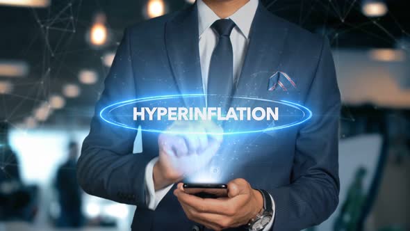 Businessman Smartphone Hologram Word   Hyperinflation alt