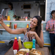 Beautiful woman taking selfie from mobile phone in cafeteria - $5.00 Beautiful woman taking selfie from mobile phone in cafeteria