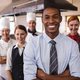 Group of hotel staffs standing with arms crossed in kitchen at hotel - $5.00 Group of hotel staffs standing with arms crossed in kitchen at hotel