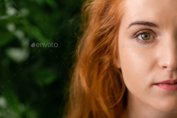 Beautiful young freckled green-eyed lady with red hair Stock Photo by  Prostock-studio