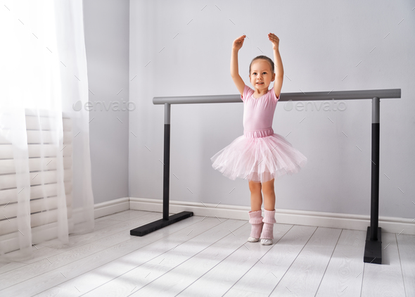 girl is studying ballet. Stock Photo by 