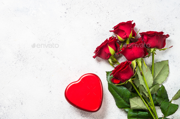 Valentines day background. Red roses and heart on white. Stock Photo by  Nadianb