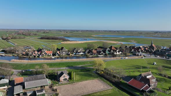 Small Historic Typical Dutch Polder Farm Village in Green Countryside Sunny Spring Landscape with alt