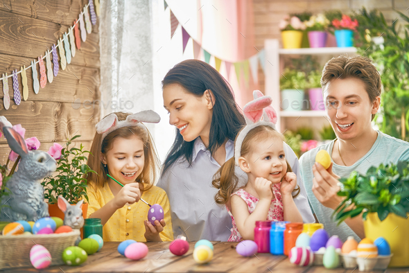 family are painting eggs - Stock Photo - Images