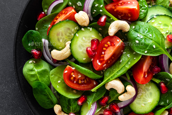 Spinach salad with vegetables and nuts - Stock Photo - Images